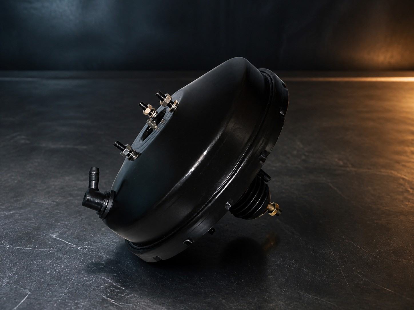 AOYIDA black vacuum brake booster in an industrial studio