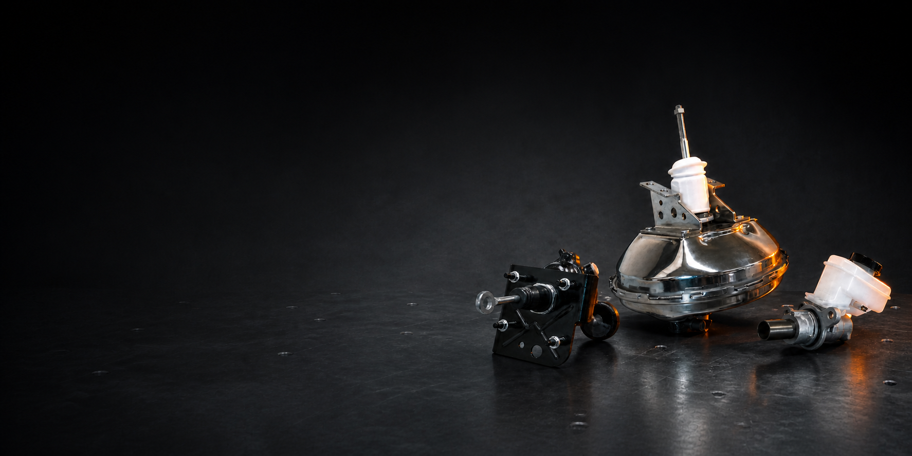 Three complete AOYIDA brake-actuation products in a dark engineering studio